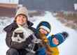 © Chepko Danil - boys plays with a cat outdoors in winter