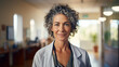 © Oleksandr - Portrait of a mature female doctor smiling at the camera while standing against a clinic background. ai generative