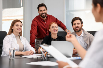 Poster - Team of employees working together in office