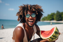 Very Happy Young Afro Man Eating Watermelon On The Beach
