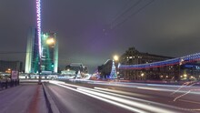 New Arbat Street, A Bustling Central Thoroughfare In Moscow, Comes To Life In The Glittering Winter Night. Watch As Car Traffic Flows Along This Iconic Street In This Captivating Timelapse Scene