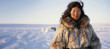 Inuit woman in traditional fur attire in Alaskan wilderness