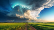Large cumulonimbus cloud with a blue-green hue backlit by the sun creates a dramatic contrast over a bright green field with a dirt road running through it against a visible horizon.