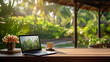 Laptop on wooden table top, blurry background of tropical garden, clam quite setting