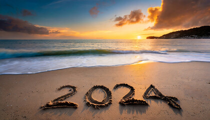 New year, 2024 written in sand on a beach during soft sunset.