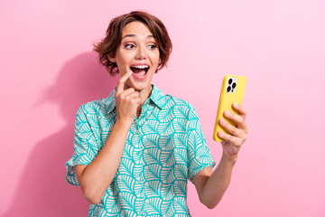 Poster - Portrait of pretty impressed girl finger touch lips open mouth use smart phone isolated on pink color background