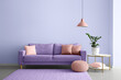 © Pixel-Shot - Interior of modern room with comfortable lilac sofa and table