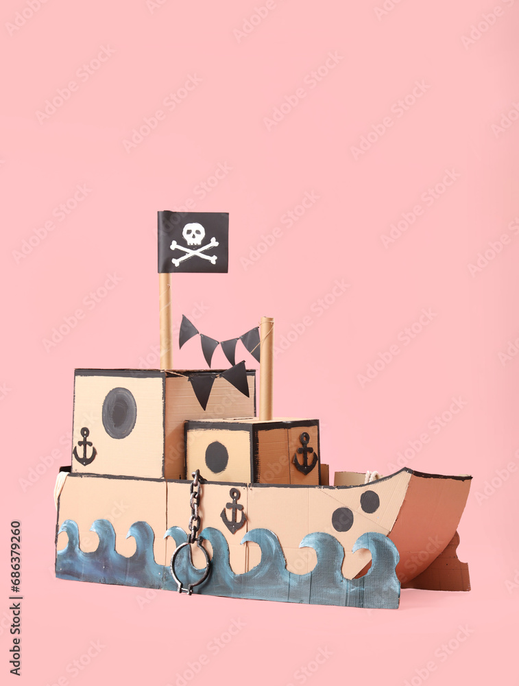 Pirate cardboard ship on pink background