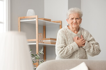 Sticker - Senior woman having heart attack at home