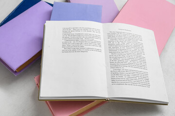 Poster - Open and closed books on white table