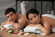 © Pixel-Shot - Young couple relaxing in spa salon, closeup