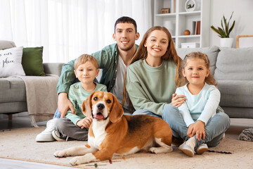 Sticker - Little children with their parents and Beagle dog lying on floor at home