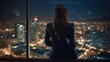 Successful Businesswoman in Stylish Suit Working on Top Floor Office Overlooking Night City. High Achievement Female CEO of Humanitarian Investment Fund, Human Face of Sustainable Corporate Governance