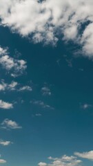 Wall Mural - Quality vertical time lapse of a blue sky. No birds, no flicker