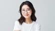 © Phoophinyo - Attractive brunette Asian woman wearing a white t-shirt and glasses Isolated on white background.