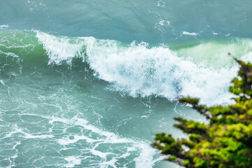 Wave splashing close-up. Crystal clear sea water, in the ocean in San Francisco Bay, blue water, pastel colors.