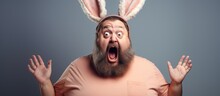 Fat Man With Beard Wearing Bunny Ears Looks Disgusted.