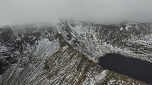 Scenic Drone Video Of Striding Edge Ridge On Helvellyn In Snowy And Wintery Conditions - Lake District, UK