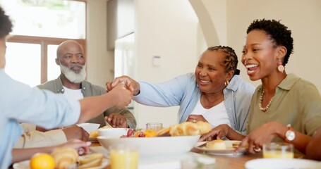 Canvas Print - Happy, black family and children at table for lunch, supper and eating meal at home together. Grandparents, parents and kids with food for bonding, relax and talking in dining room for nutrition