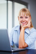 © STEEX/peopleimages.com - Portrait, smile and woman in office with laptop, market research or online website review. Happy businesswoman at desk writing article, email report or business schedule with career in administration