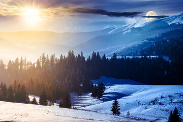 Wall Mural - winter solstice in carpathian mountains. landscape with forested snow covered hills beneath a sky wi
