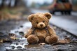 Dirty teddy bear toy lies outdoors on the road. AI Generated