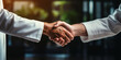 © Bartek - Two Professionals in White Shirts Shaking Hands in Agreement in an Office Setting Illuminated by Warm Light