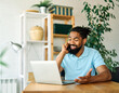 © Lumos sp - man computer laptop business working home businessman internet office smart phone smartphone mobile call online young desk communication casual black african american entrepreneur