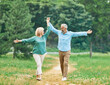 © Lumos sp - woman man mature couple happy together active bonding park outdoor middle aged talking leisure park fun smiling love old middle mid aged nature wife walking