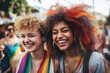 Lovely laughing female gay couple having fun at the LGBTQI pride parade