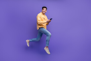 Poster - Full body photo of nice young male instagram twitter facebook telegram wear trendy yellow outfit isolated on violet color background