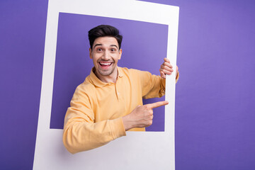 Sticker - Photo portrait of nice young male instant photo frame point empty space wear trendy yellow outfit isolated on violet color background