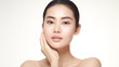 Beautiful young asian woman with clean perfect skin. Portrait of beauty model with natural makeup and touching her face.

