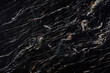 Dark granite slack with light and yellow veins, large format texture,