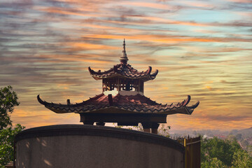 The roof of the temple, a place of worship for the Confucian community, with a beautiful sky in the background