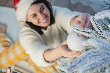 Poster - happy smiling woman decorating christmas tree