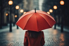 An Unrecognizable Woman Under A Red Umbrella