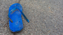 Blue Sandals That Broke On The Asphalt