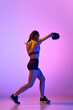 © Lustre Art Group  - Striking image of female, professional sportsman, boxer showcasing her prowess in boxing gear against gradient studio background in neon filter.