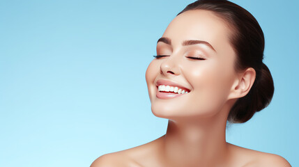 Portrait of a young woman with natural makeup and natural styling on blue background.