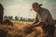 © Antonio - close view of a farmer stacking hay on his farm. Generative AI