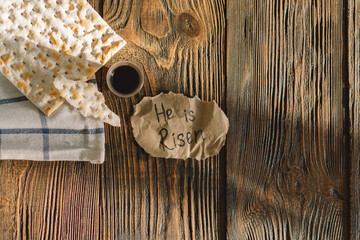 Wall Mural - He is risen. Communion. Religious tradition of breaking bread. Bread and wine as a sign of memory of Christ's sacrifice.