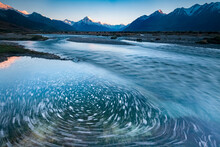 Slow Shutter Speed Captures The Motion Of The Tasman River Coming Off The Tasman Glacier; South Island, New Zealand