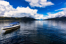 A Small Pleasure Boat Tied Up On The Shoreline Of Beautiful Shuswap Lake During The Autumn Season; Shuswap Lake, British Columbia, Canada