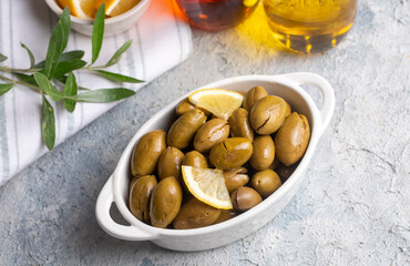 Wall Mural - Cracked green olives. Cracked green olives with lemon. Turkish style olive (Turkish name; kirma zeytin)