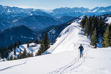 germany, bavaria, brauneck, man on a ski tour in winter in the mountains