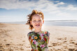 Netherlands, Zandvoort, portrait of redheaded girl on the beach