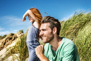 Poster - Netherlands, Zandvoort, father and daughter on in beach dunes looking out