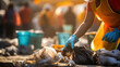 © Mosaic Media - Close-up of a young volunteer, emphasizing global pollution concerns while cleaning up trash.Pollution Concept