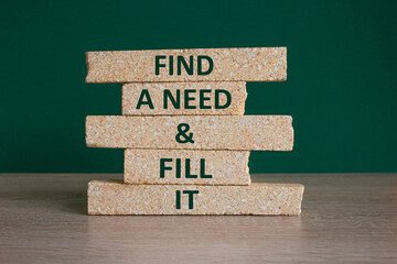 Find a need and fill it symbol. Concept words Find a need and fill it on brick blocks. Wooden table, beautiful green background. Business and find a need and fill it concept. Copy space.